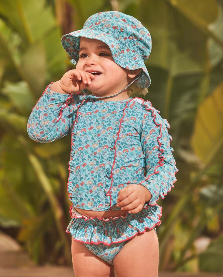 Camiseta de ba&ntilde;o azul  con protecci&oacute;n solar estampado flores