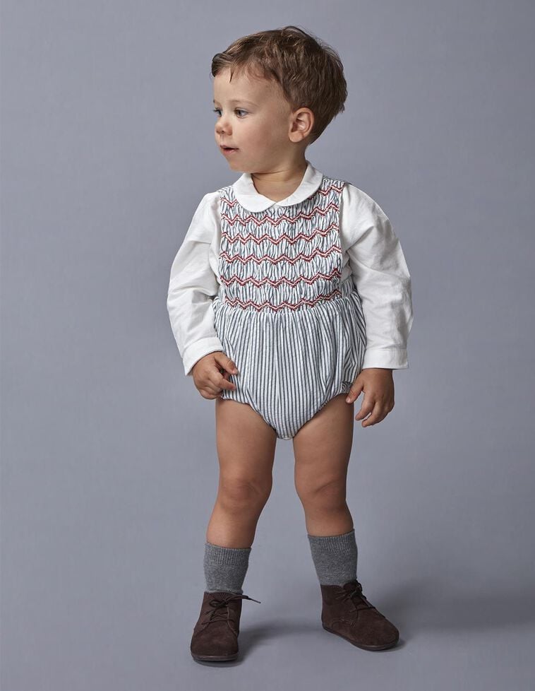 Ranita de rayas con smock azul claro Ranita de rayas con smock azul claro