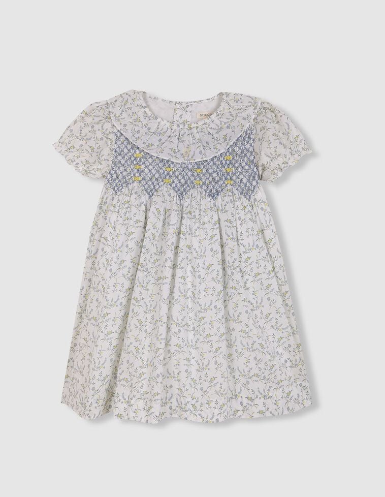 Vestido de florecitas con nido de abeja a mano azul