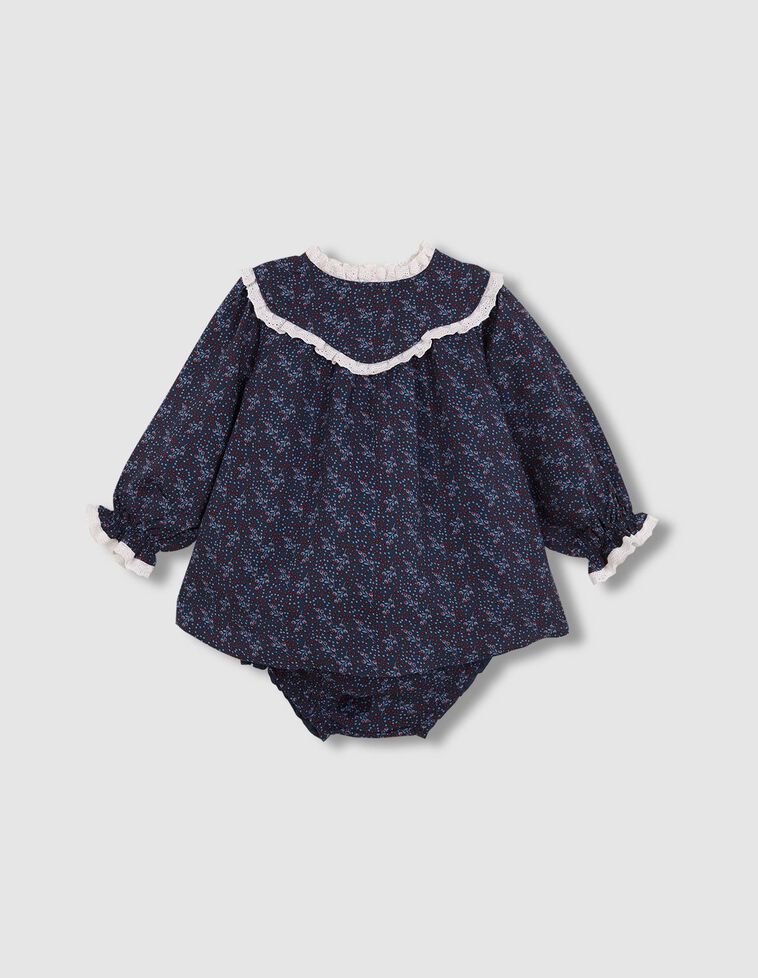 Vestido estampado sobre fondo azul tiras bordadas en contraste azul
