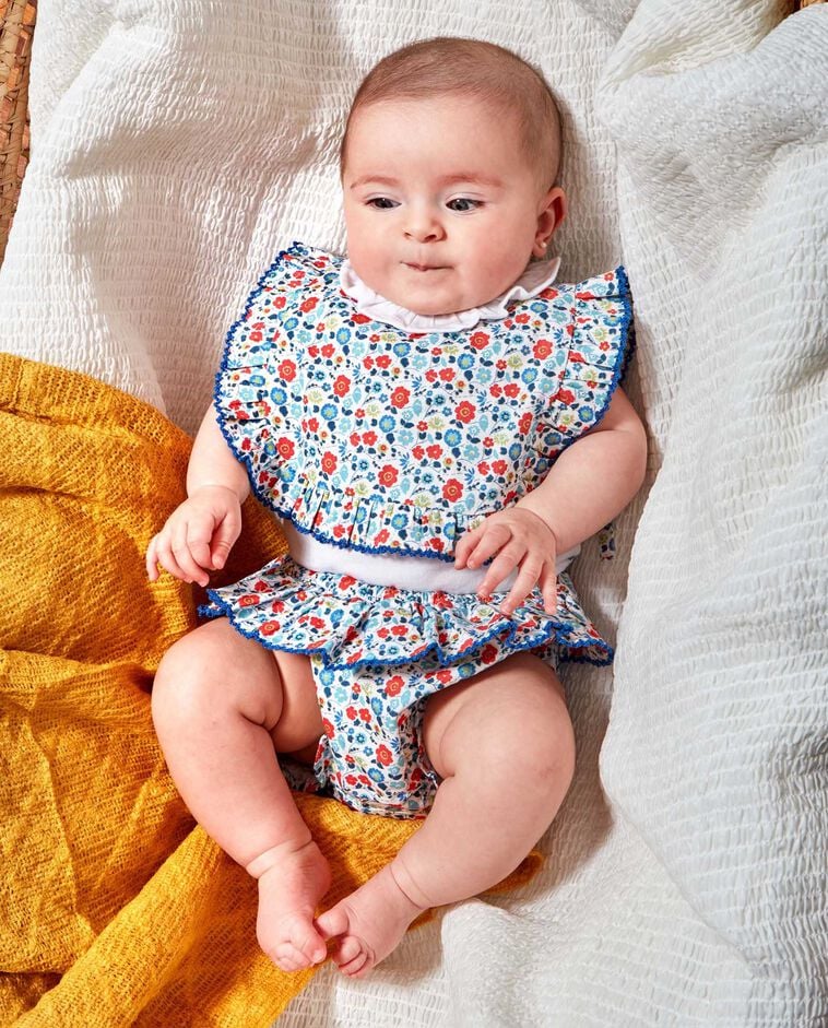 Babero flor fluor blanco