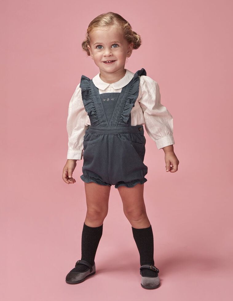 Peto corto de rayas con volantes azul claro